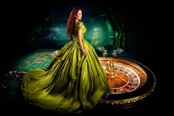 4777GEM — A high-class gaming experience without limits A woman in a luxurious green gown next to an ornate roulette wheel, capturing the upscale casino mood of 4777GEM.